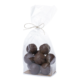 Chocolate balls in a transparent bag, tied together with a natural string, present a delicious treat.